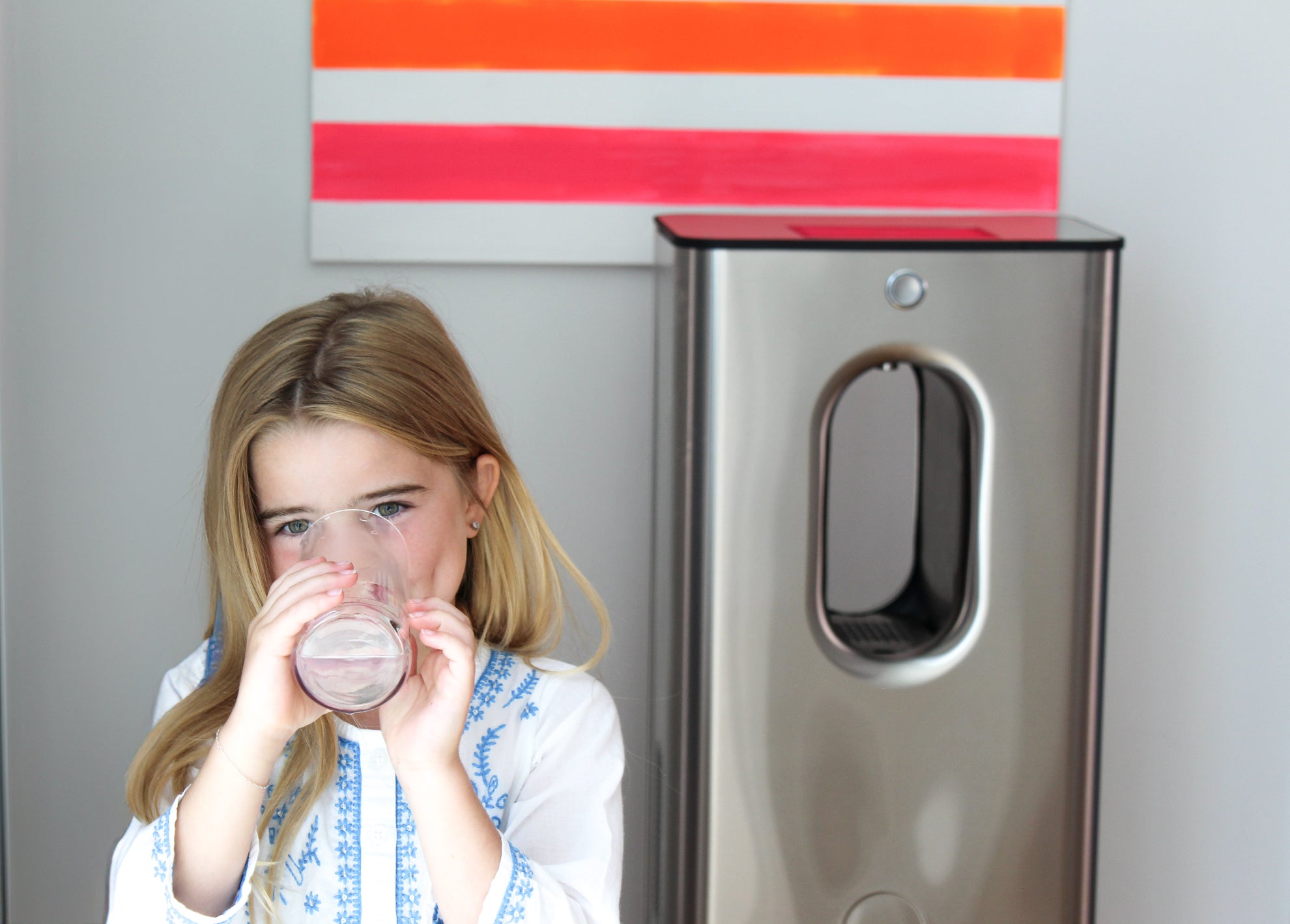 Child drinking water from air to water machine