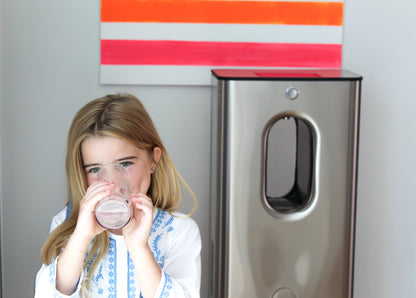 Child drinking water from air to water machine